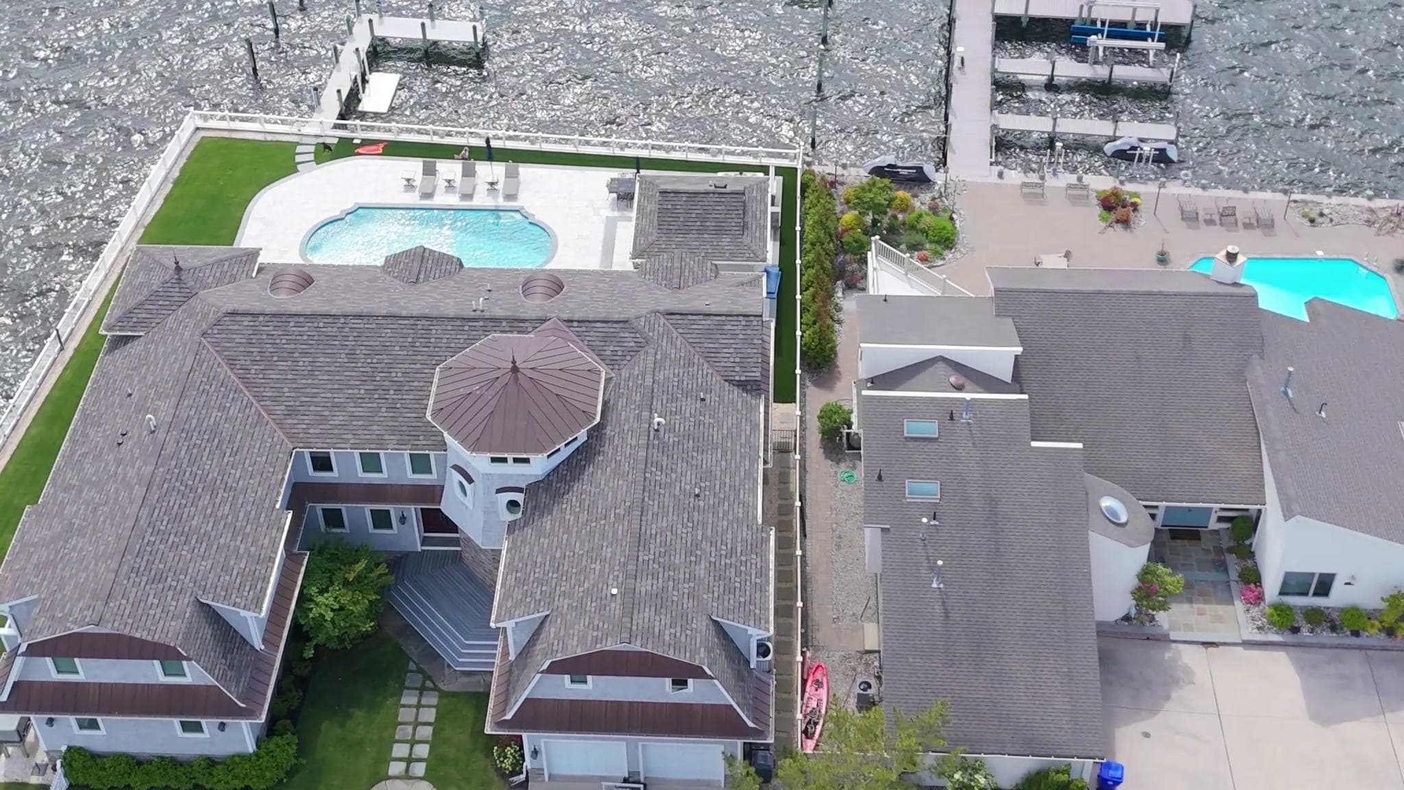 Aerial view of completed A&J roofs on a waterfront street in New Jersey