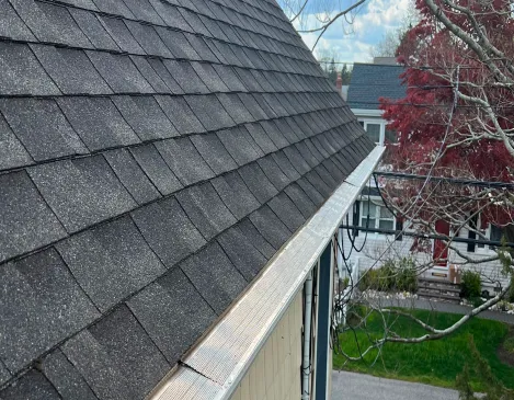 Finished gutter line along a shingle roof edge