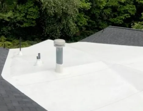 Close-up of a finished flat commercial roof and vent