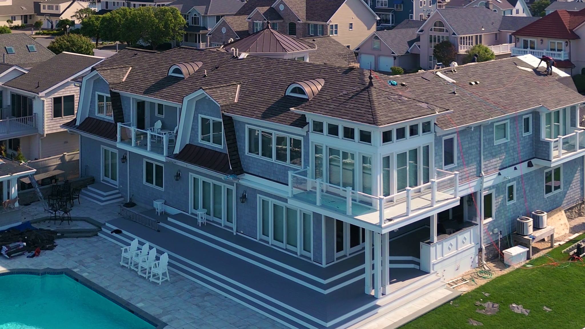 Aerial view of a waterfront New Jersey home with a completed A&J shingle roof