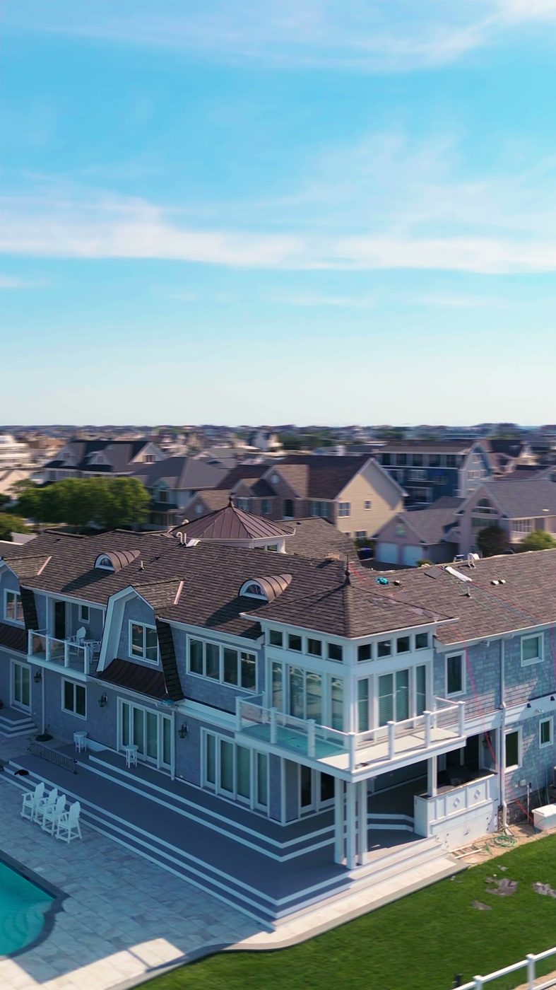 A finished roof on a large house photographed from the air